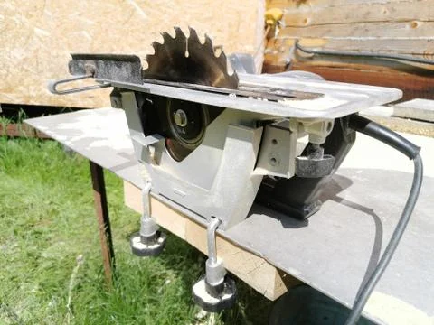 Electrified circular saw installed on the table. Tool for sawing lumber Stock Photos