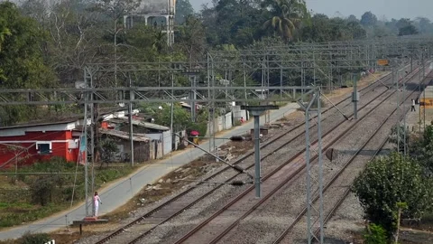 Electrified Railway Tracks Passing Through Residential Area in Dibrugarh Stock Footage 328821570