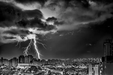 Electrifying Lightning Storm Over Cityscape Stock Photos
