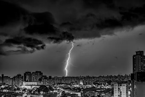 Electrifying Lightning Storm Over Cityscape Stock Photos