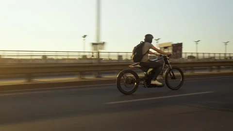 Electro bike on the road sunset Stock Footage 196698586