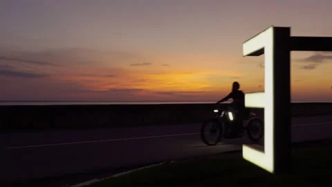 Electro bike on the road sunset Stock Footage 197282293