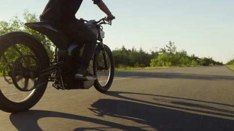 Electro bike on the road sunset Stock Footage 197282655