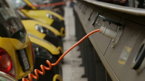 Electro car is charging in the street Video stock 74414258