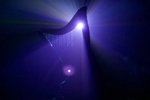 Electro harp in the rays of light Foto stock