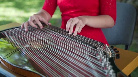 Electro harp. Women's hands play a stringed musical instrument Stock Footage 247124206