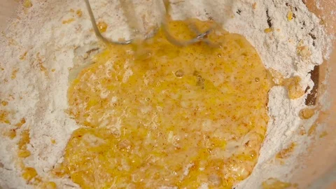 Electro mixer whipped thick dough from ingredients. Slow motion, closeup Stock Footage 76167059