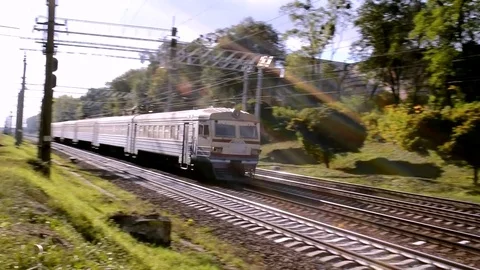 Electro Train Motion On Railway In Sunlight On The Camera With Turning View Stock Footage 84905478