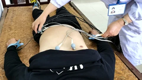 Electrocardiographic examination Stock Footage 184188037