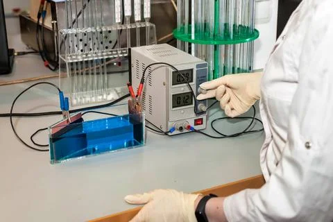 Electrolysis process. Close up hands working with equipment for electroanalys Stock-Fotos