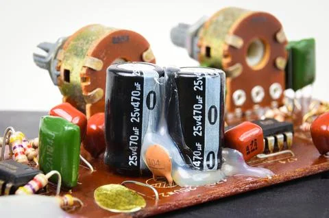 Electrolyte or electrolytic capacitors row on electronic circuit board Stock Photos