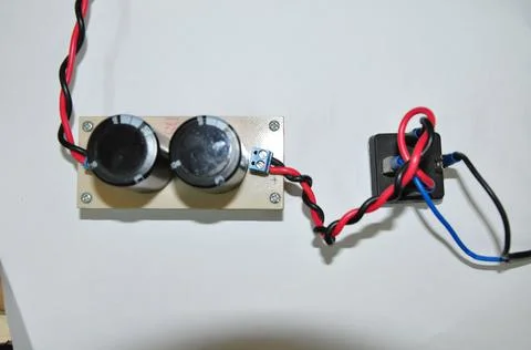 Electrolytic capacitor and diode bridge which are part of the converter Stock Photos