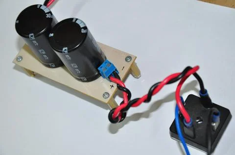 Electrolytic capacitor and diode bridge which are part of the converter Stock Photos