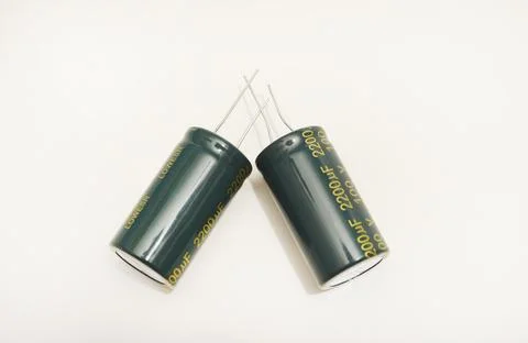 Electrolytic capacitors on a white background. Electronic elements for elec.. Stock Photos