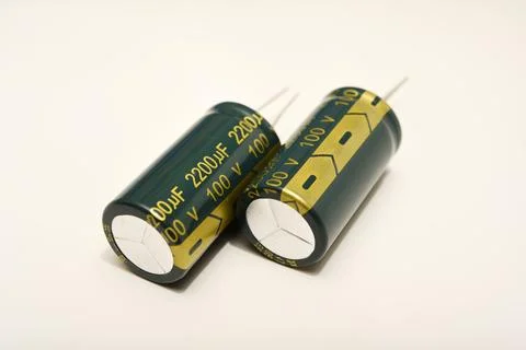 Electrolytic capacitors on a white background. Electronic elements for elec.. Stock Photos