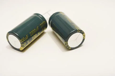 Electrolytic capacitors on a white background. Electronic elements for elec.. Stock Photos