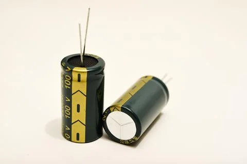Electrolytic capacitors on a white background. Electronic elements for elec.. 스톡 사진