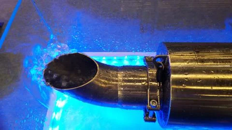 Electromagnetic flowmeter counter under bubbling water. Metal steel pipe. Bub Stock Photos