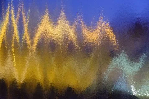 Electromagnetic lines and impulses texture on multi-colored ribbed glass Foto stock