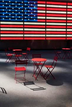 Electronic American Flag with empty tables and chairs, Times Square, New York Stock Photos