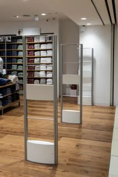 Electronic anti-theft gate system at retail shop entrance to deter shoplifting Stock Photos