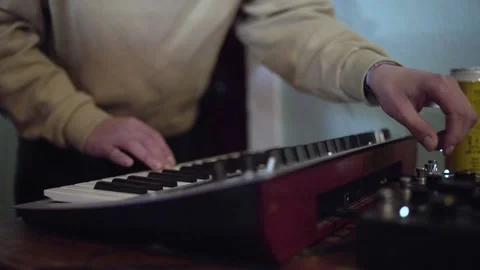 Electronic artist playing synthesiser Stock Footage 229579074