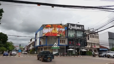 Electronic billboard at Intersection, traffic,Buddhist ceremony, Vientiane 스톡 동영상 75823866
