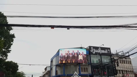 Electronic billboard shows ASEAN summit, electric cables, Vientiane, Laos 스톡 동영상 75252962