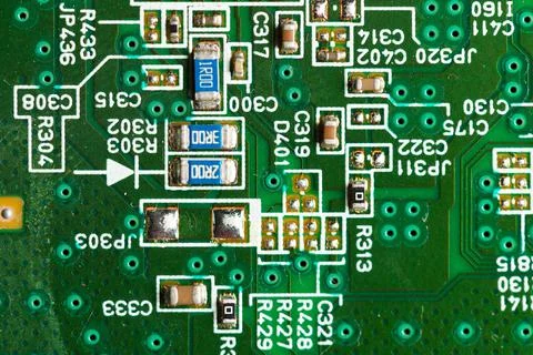 Electronic board close-up. Resistance elements and resistors on a green PCB 스톡 사진