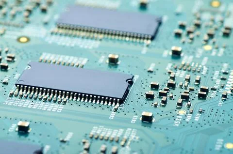 Electronic board with microchips and electronic parts close-up Stock Photos
