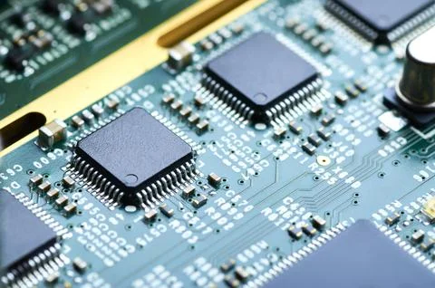 Electronic board with microprocessor and electronic parts close-up Stock Photos