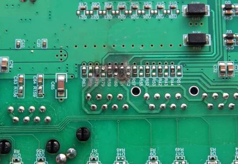 Electronic board with numbered burnt out silver pins texture background Stock Photos
