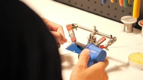 Electronic board soldering pin header top view Stock Footage 261381693