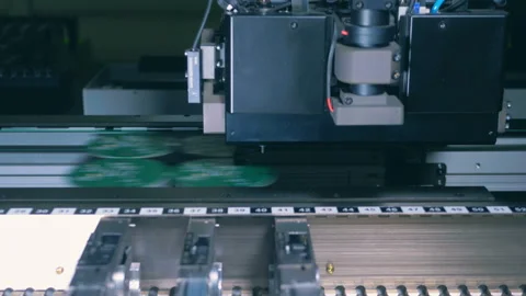 Electronic boards are getting assembled by an industrial machine Stock Footage 102585364