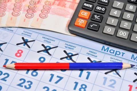 Electronic calculator, red and blue pencil and banknotes of five thousand rub Stock Photos