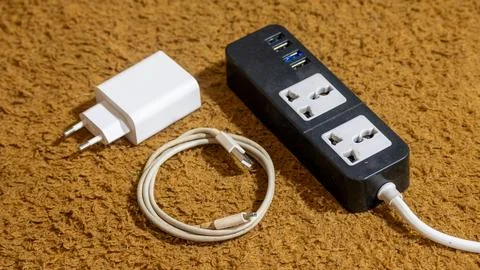 Electronic Charging Essentials with Universal Power Strip Stock Photos