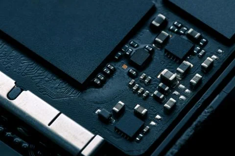 Electronic chip component on black PCB or printed circuit board Stock Photos
