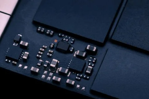 Electronic chip component on black PCB or printed circuit board Stock Photos