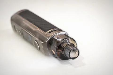 Electronic cigarette on a blurred background Stock Photos