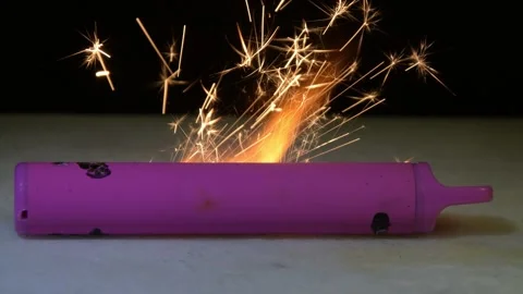 The electronic cigarette bursts into flames, bright sparks appear around. Video stock 323141433
