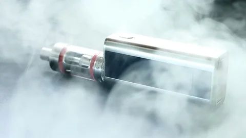 Electronic cigarette close-up in smoke Stock Footage
