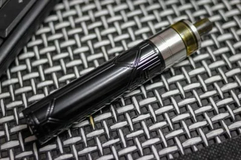 Electronic cigarette, computer keyboard and mouse Stock Photos