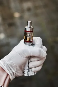 Electronic cigarette in hand Stock Photos