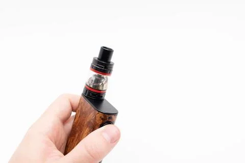 Electronic cigarette or vaping device on hand Stock Photos