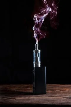 Electronic cigarette over a dark background Stock Illustration