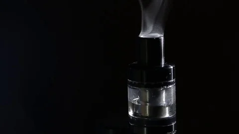 Electronic cigarette in the smoke - atomizer closeup Stock Footage 74874862