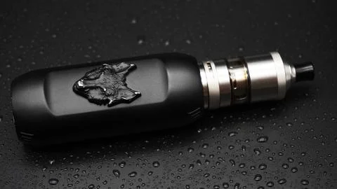 Electronic cigarette with wolf. Full HD. Black background. Stock Photos