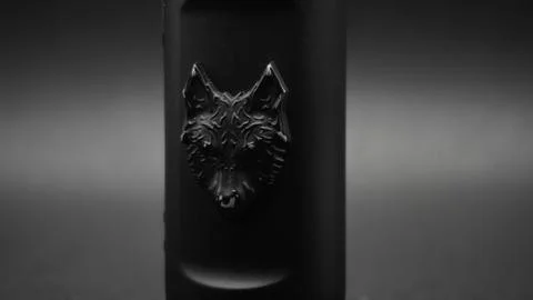 Electronic cigarette with wolf. Full HD. Black background. Stock Photos