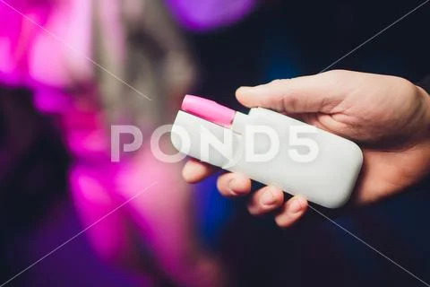 Electronic cigarettes, technology cigarette. Tobacco system IQOS male hand on Stock Photos