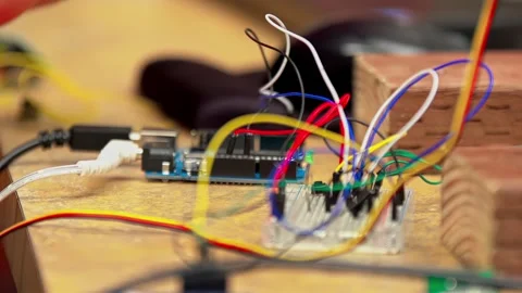 Electronic circuit being prototyped on a solderless breadboard, AI computer Stock Footage 325057703